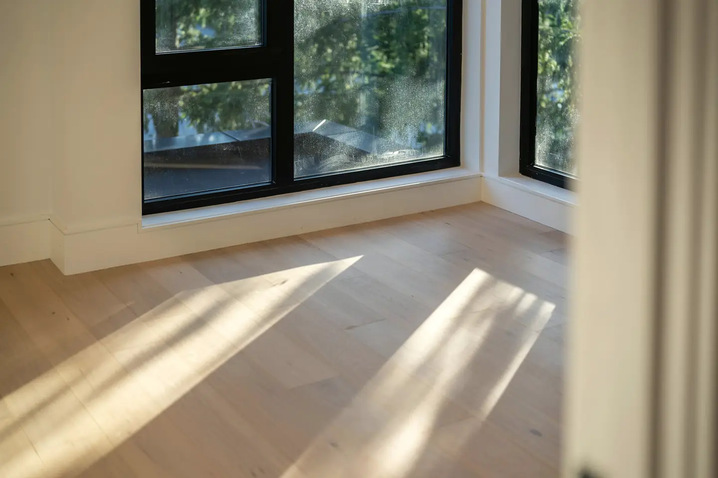 A sea-facing living room, its light changing with the hour